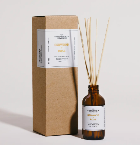 Infuse your space with a continuous, flame-free modern garden escape using an elegant amber glass reed diffuser packaged in a minimalist kraft gift box.
