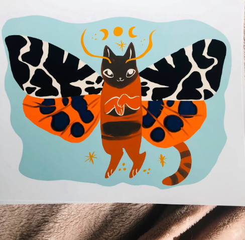 A lovely art print featuring the Garden Tiger Cat Moth with colorful wings, ready to bring charm and whimsy to your home decor.