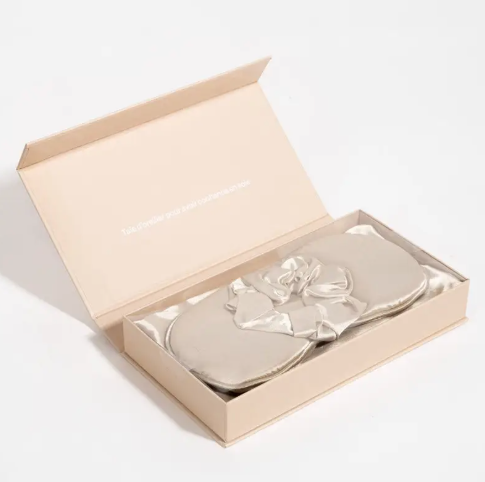 The satin sleep set folded neatly, showcasing its soft material and elegant design, perfect for a gift.