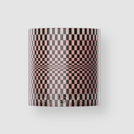 The Boy Smells Hinoki Fantôme candle in a pink and black checkered holiday vessel.