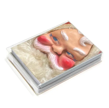 Close-up of Santa Doll Holiday Greeting Card by The Mincing Mockingbird featuring a mischievous vintage Santa illustration - Box set of 8