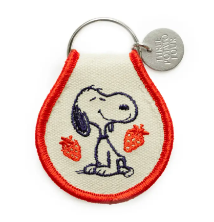 Double-sided Snoopy Strawberry patch keychain made from natural oxford cotton with a sturdy metal keyring.