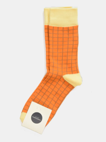 Window-Pane Socks by Curated Basics in a Orange-Yellow color combination.