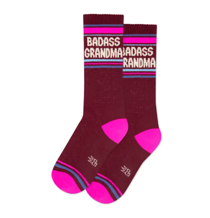 Thick ribbed gym socks featuring vintage-inspired athletic stripes and a "Badass Grandma" statement.