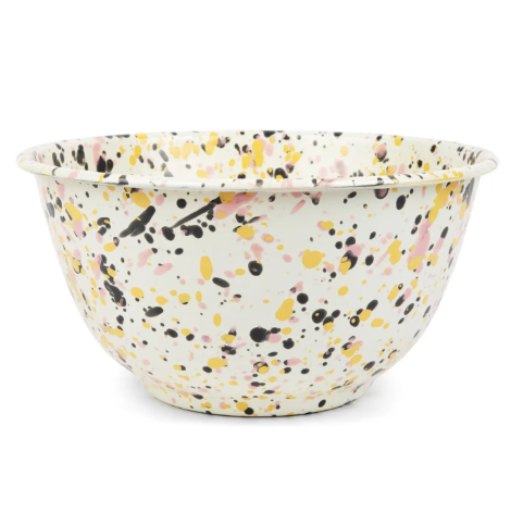 Catalina Large Salad Bowl in Pink Sunset, showcasing its unique enamel splatter design and smooth, curved shape.