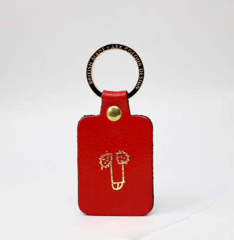 Red leather willy keyring with a gold-plated ring, a humorous and high-quality novelty keychain.