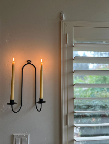 Beeswax taper candles by Busy Bees Candle Co., showing the natural golden yellow color.