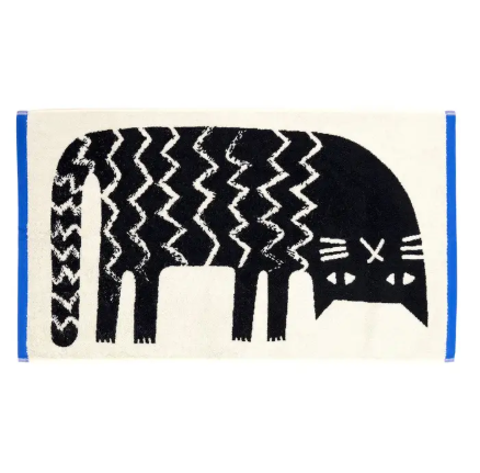 A soft cotton hand towel featuring a whimsical black-and-white jacquard design of a lazy cat stretching with a zig-zag patterned body.