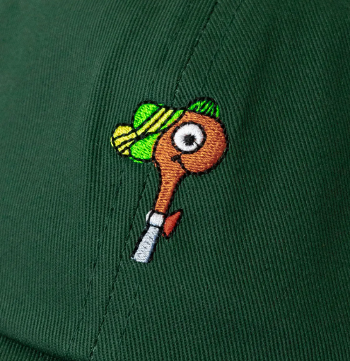 A close-up of a dark green cotton twill baseball cap, highlighting the charming Lowly Worm embroidery.