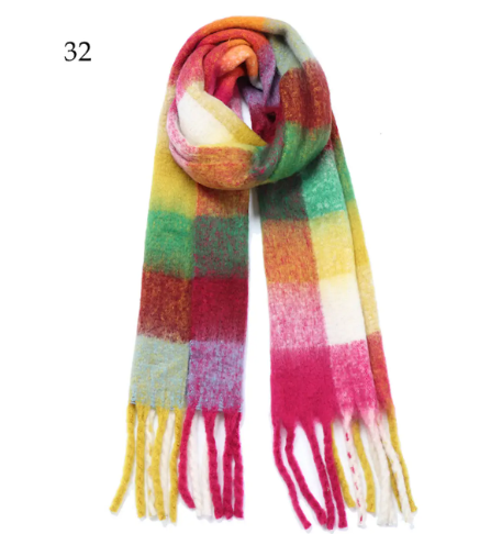 A multi-color brushed scarf in warm yellow and red plaid, a super soft accessory for colder days.