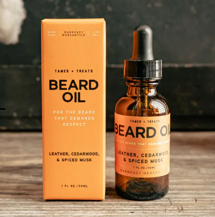 The Orange Label Beard Oil by Manready Mercantile featuring scents of Leather and Cedarwood for a healthy beard.