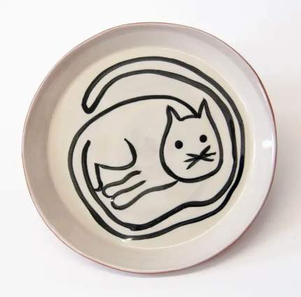 A whimsically designed cat-themed appetizer plate that is both dishwasher and microwave safe for daily use.