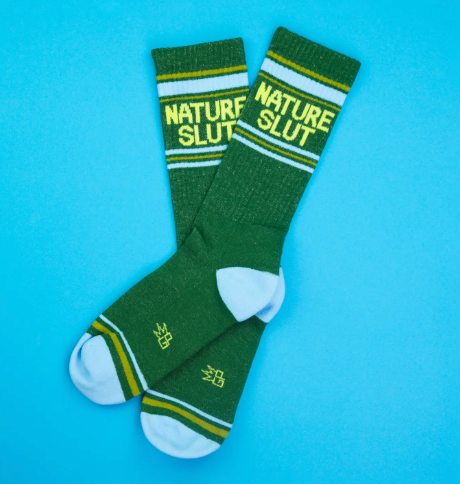 A pair of comfortable cotton blend socks made in the USA with a cheeky nature-themed design for adventurous spirits.