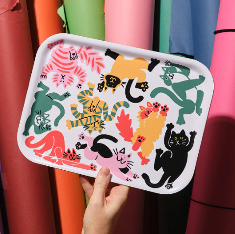 A small rectangular birch serving tray featuring a colorful, energetic illustration of multiple cats in bright primary colors.