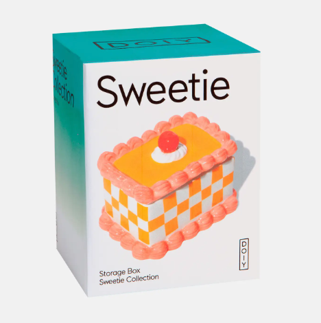 Gift a slice of retro charm with a decorative cake-themed ceramic jewelry container packaged beautifully in a modern turquoise and white Sweetie Collection gift box.