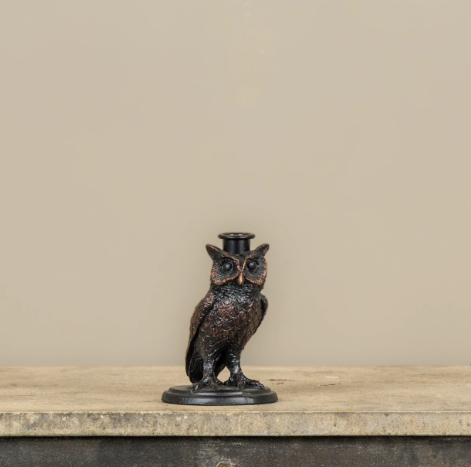 Add a touch of wise vintage charm to your tabletop with the Black Owl Taper Candle Holder by Ragon House, showcasing detailed resin craftsmanship on a sturdy metal base.