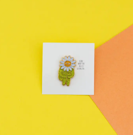 Flower Boy Enamel Pin by The Peach Fuzz, showcasing its glittery design and "WTFlower"