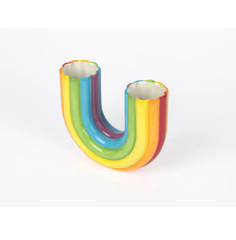The glossy ceramic rainbow vase, highlighting its U-shape and colorful, bumpy texture.