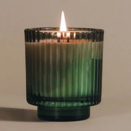 The Elsewhere Candle collection showcasing Desert Kush's unique fragrance scent profile and sustainable glass packaging.