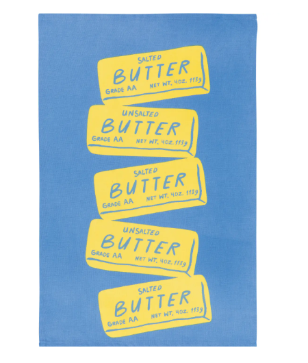 Brighten your kitchen with the Butter Sticks Dishtowel by Danica Jubilee, featuring stacked yellow butter stick illustrations on a vibrant blue background.