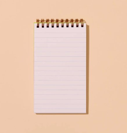 The open spiral notebook showing the lined pages and the durable spiral binding, perfect for lists and notes.