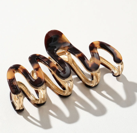 A stylish 4-inch Willow Vintage squiggle claw clip by Adorro featuring a classic Deep Tortoise finish and a durable metal base.