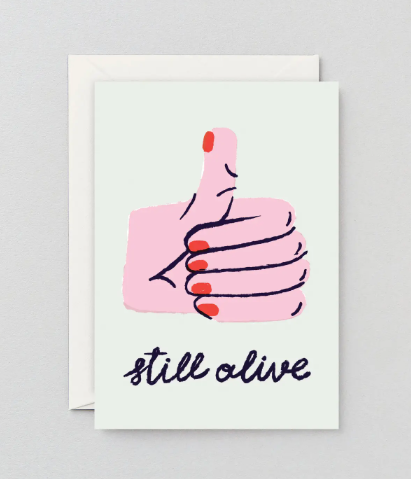 Humorous survival and birthday card by Wrap featuring artwork by Rozalina Burkova and a natural paper envelope.