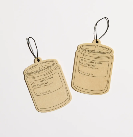 Candle Co. air freshener featuring a minimalist design and signature typography for the Amber & Moss scent.