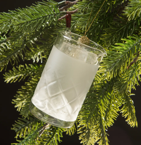 The perfect holiday gift, a hand-blown glass ornament of a classic bar mixing glass hanging on a Christmas tree.