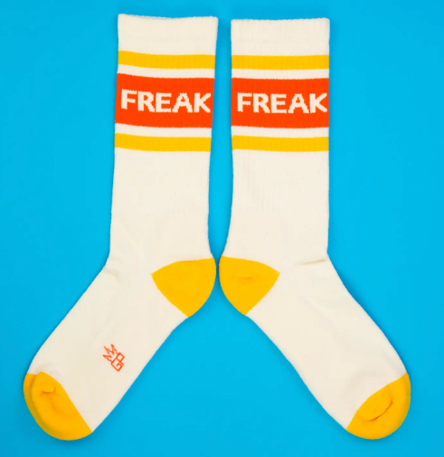 Show off your individuality with the Gumball Poodle "FREAK" Gym Crew Socks, seen here comfortably worn, highlighting their expressive design and perfect fit for everyday wear.