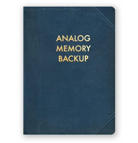 A medium-sized journal with a faux vintage cover and gold lettering that reads "Analog Memory Backup".