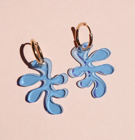 Show off your playful style with the versatile See-thru Blue Ant Charm Earrings, featuring a removable, brightly colored acrylic shape.