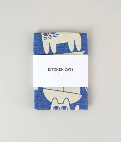 The Kitchen Cats Cotton Tea Towel by Wrap, a fun and absorbent kitchen essential designed by Elliot Kruszynski.