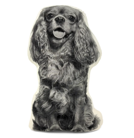 Accentuate a stylish neutral sofa or lounge chair with an artisan-crafted black and white screenprinted spaniel accent pillow that contours to the shape of a dog.