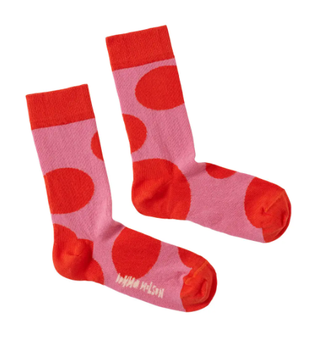 A pair of cozy and colorful socks with a big spot pattern, made from 100% cotton.