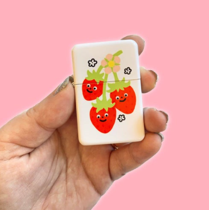 Sweet Strawberry Lighter by The Peach Fuzz, showcasing the unique design and refillable feature.