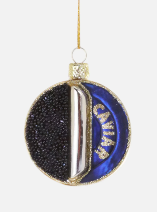A round glass Caviar Tin Ornament in navy blue, gold, and black beads, hanging from a gold cord.