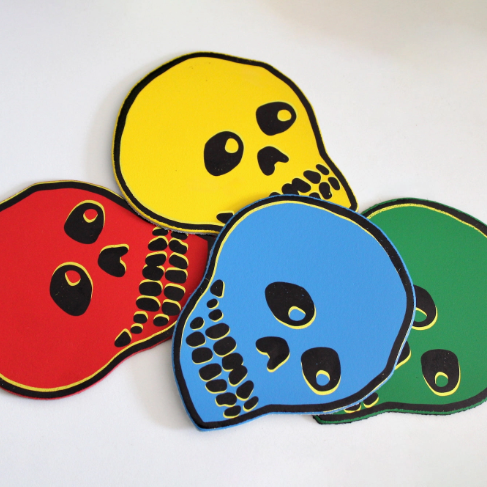 Showcase the bold graphic lines and playful screen-print style of the Ark Colour Design Leather Skull Coasters set.