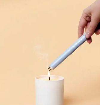 A sleek matte grey Electric Candle Lighter by Nomatiq with a long-reach neck and battery indicator lights.
