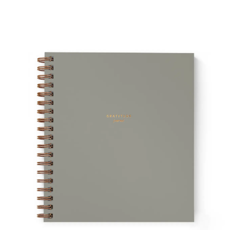 A calming light sage mini gratitude journal with chic gold foil details, a perfect tool for cultivating a more positive mindset.