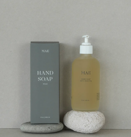 The MAE Hinoki Hand Soap in a frosted glass bottle, featuring the calming, woodsy essential oil blend.