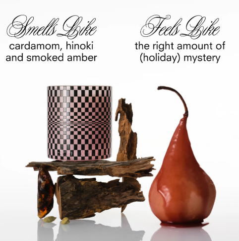 A luxury candle with a smoky-sweet scent, packaged for the holidays.