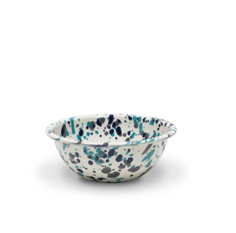 Catalina Cereal Bowl in Blue Tides, showcasing its unique enamel splatter design and smooth, curved shape.