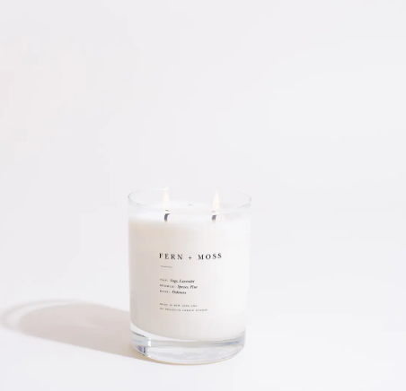 A double-wicked Fern + Moss candle, featuring woodsy notes of pine and spruce with a long 70-hour burn time.