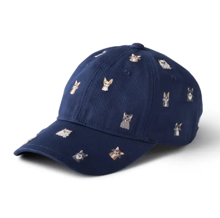 A navy blue six-panel baseball cap featuring several small, unique cat illustrations embroidered across the front and brim.