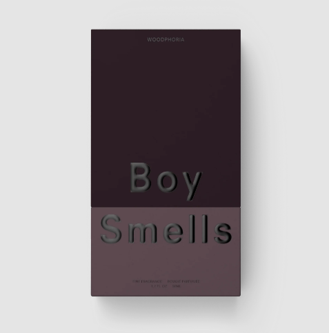 The Boy Smells Woodphoria perfume bottle in a deep aubergine and pink dual-toned shade.