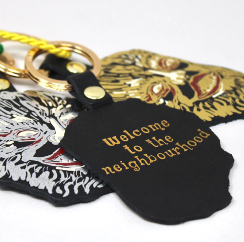 Reveal the charming 'Welcome to the Neighbourhood' embossing on the reverse of the Ark Colour Design Leather Werewolf Key Ring.