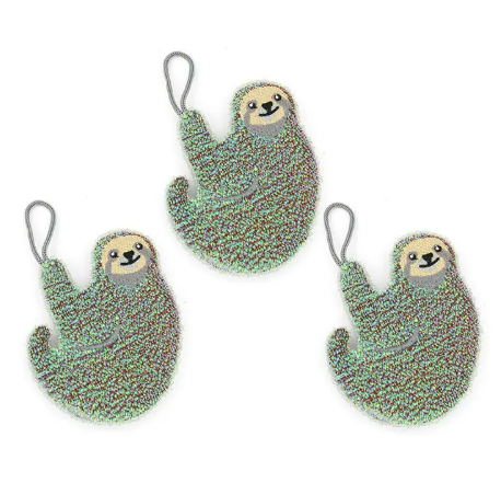 A set of three sloth-shaped kitchen sponges in natural tones with built-in hanging loops for easy storage.