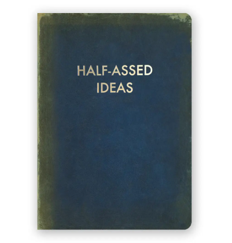 A medium-sized journal with a faux vintage cover and gold lettering that reads "Half-Assed Ideas".