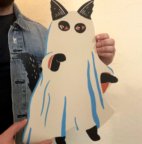 Add whimsical charm to your decor with the ghost-costumed Phantom Cat cutout wall decoration by Zander Mack.